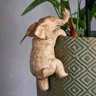 Artistic Elephant Climbing Sculpture | Whimsical Design