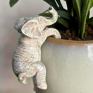 Artistic Elephant Climbing Sculpture | Whimsical Design