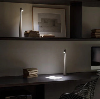 Compact portable lamp, versatile design