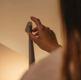 Compact portable lamp, versatile design