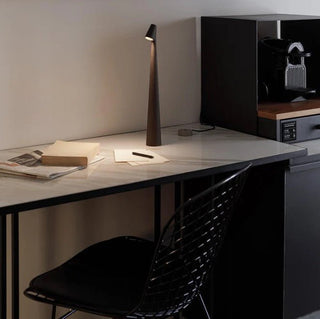 Compact portable lamp, versatile design